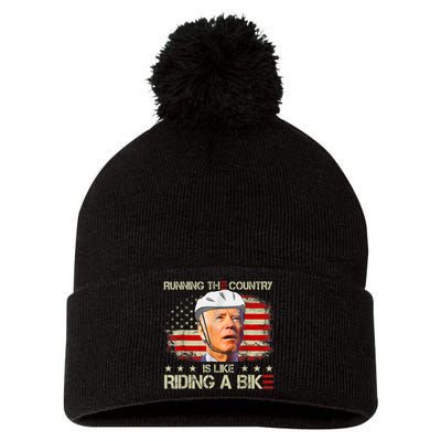 Joe Biden Falling Off Bike, Running The Country Is Like Riding A Bike Pom Pom 12in Knit Beanie