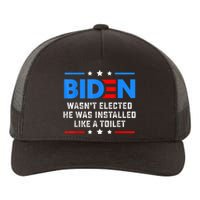 Joe Biden Wasn’t Elected He Was Installed Like A Toilet Yupoong Adult 5-Panel Trucker Hat