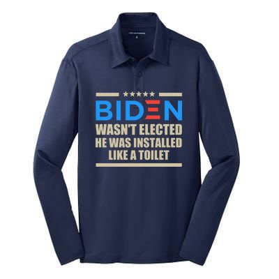 Joe Biden Wasn’t Elected He Was Installed Like A Toilet Silk Touch Performance Long Sleeve Polo