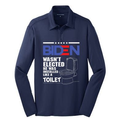 Joe Biden Wasn’t Elected He Was Installed Like A Toilet Silk Touch Performance Long Sleeve Polo