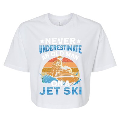 Jet Skiing Never Underestimate An Old On A Jet Ski Gift Bella+Canvas Jersey Crop Tee