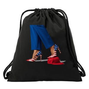 Kamala Harris With High Heels Stepping On Red Hat Drawstring Bag