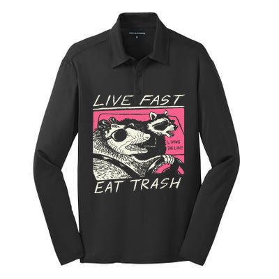 Live Fast Eat Trash And Get Hit By A Car Sunset Raccoon Silk Touch Performance Long Sleeve Polo