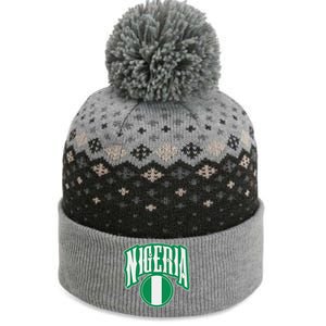 Love Nigeria With Nigerian Flag Inside A Circle The Baniff Cuffed Pom Beanie