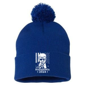 Magadonia 2024 Trump Supporter Proud Trump Voter Magadonian Pom Pom 12in Knit Beanie