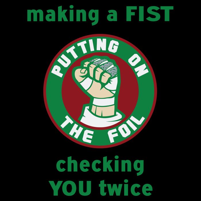 Making A Fist Putting On The Foil Checking You Twice Flexfit Unipanel Trucker Cap