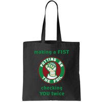 Making A Fist Putting On The Foil Checking You Twice Bag