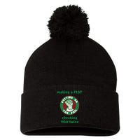 Making A Fist Putting On The Foil Checking You Twice Pom Pom 12in Knit Beanie