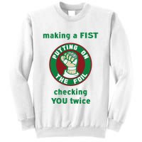 Making A Fist Putting On The Foil Checking You Twice Sweatshirt