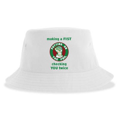 Making A Fist Putting On The Foil Checking You Twice Sustainable Bucket Hat