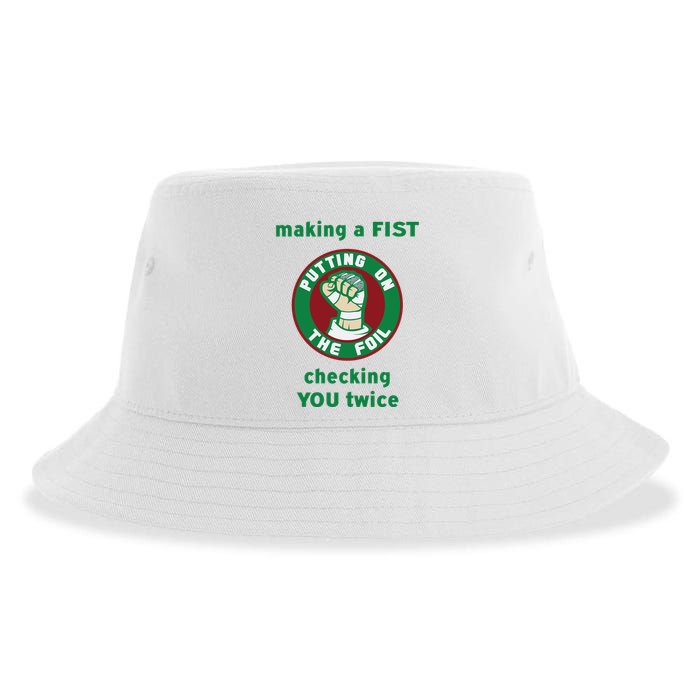 Making A Fist Putting On The Foil Checking You Twice Sustainable Bucket Hat