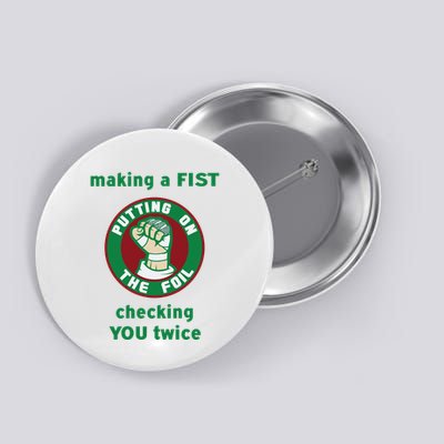 Making A Fist Putting On The Foil Checking You Twice Button