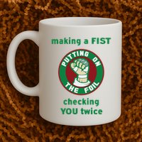 Making A Fist Putting On The Foil Checking You Twice Mug