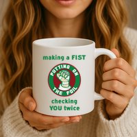 Making A Fist Putting On The Foil Checking You Twice Mug