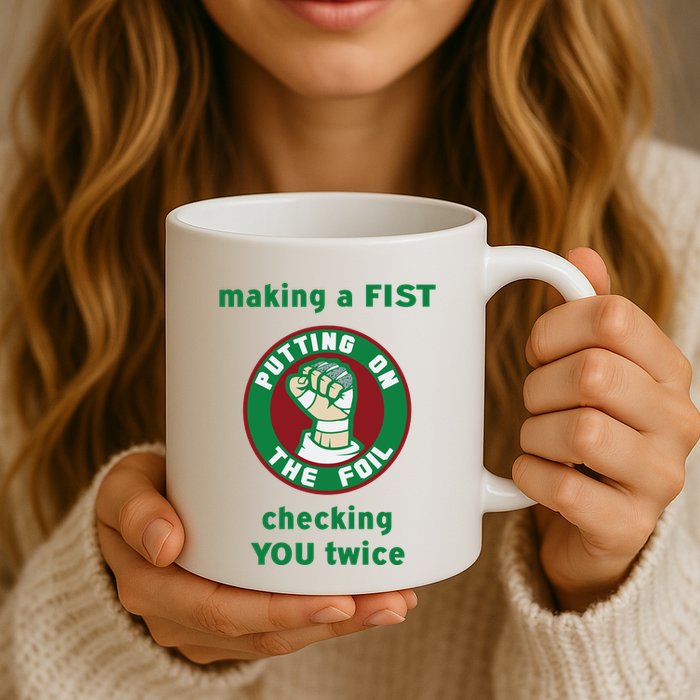 Making A Fist Putting On The Foil Checking You Twice Mug