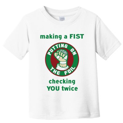 Making A Fist Putting On The Foil Checking You Twice Toddler T-Shirt
