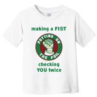 Making A Fist Putting On The Foil Checking You Twice Toddler T-Shirt