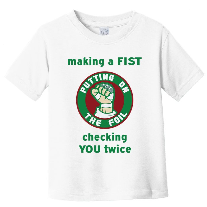 Making A Fist Putting On The Foil Checking You Twice Toddler T-Shirt