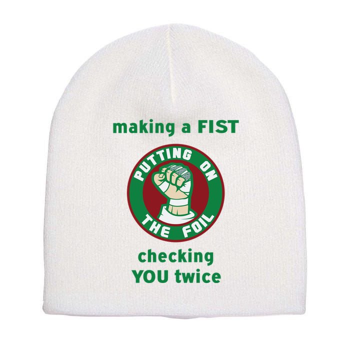 Making A Fist Putting On The Foil Checking You Twice Short Acrylic Beanie