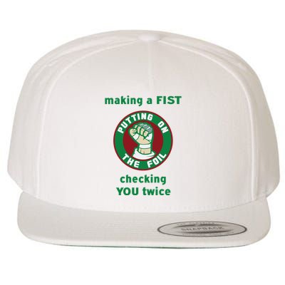 Making A Fist Putting On The Foil Checking You Twice Wool Snapback Cap