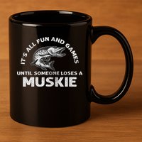 Muskie Fishing Its All Fun And Games Until Someone Loses 11oz C Handle Ceramic Mug