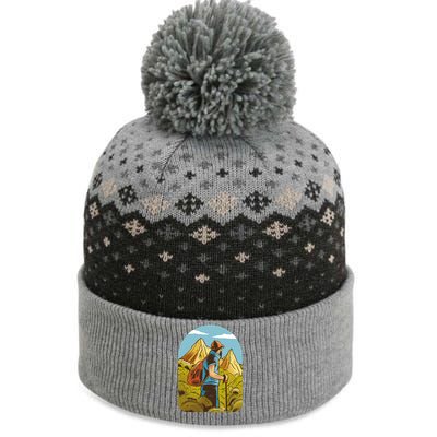 Man Hiking In The Mountains The Baniff Cuffed Pom Beanie