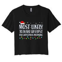 Most Likely To Wake Up First On Christmas Morning Xmas Light Women's Crop Top Tee