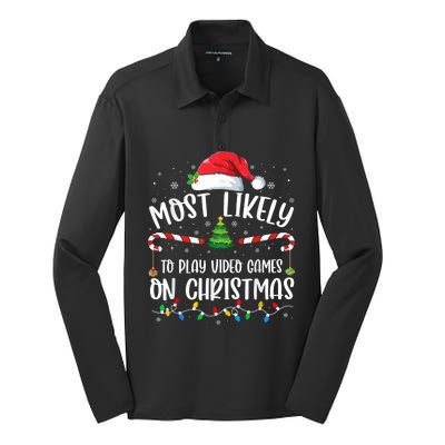 Most Likely To Play Video Games On Christmas Gamer Lovers Silk Touch Performance Long Sleeve Polo