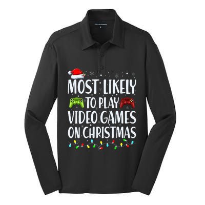 Most Likely To Play Video Games On Christmas Xmas Lights  Silk Touch Performance Long Sleeve Polo