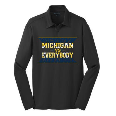 Michigan Versus Everybody Sports College Football Fan Silk Touch Performance Long Sleeve Polo