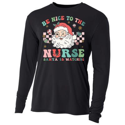 Nurse Christmas Be Nice To The Nurse Santa Is Watching Cooling Performance Long Sleeve Crew