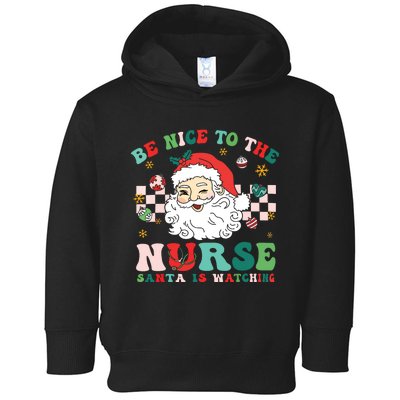 Nurse Christmas Shirts Be Nice To The Nurse Santa Is Watching Toddler Hoodie