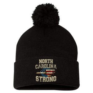 North Carolina Strong With Nc State And Usa Flag Overlay Pom Pom 12in Knit Beanie