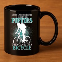 Never Underestimate A Man In His Fifties Who Can Ride A Bicycle 11oz C Handle Ceramic Mug