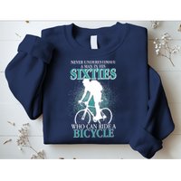 Never Underestimate A Man In His Sixties Who Can Ride A Bicycle Sweatshirt