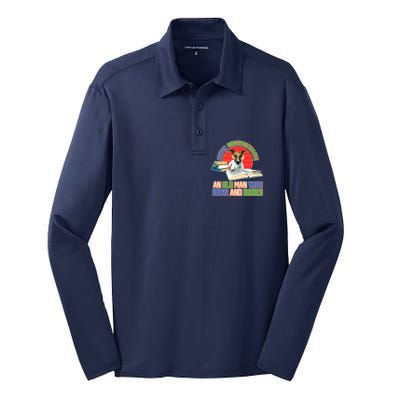 Never Underestimate An Old Man With Dogs And Books Silk Touch Performance Long Sleeve Polo