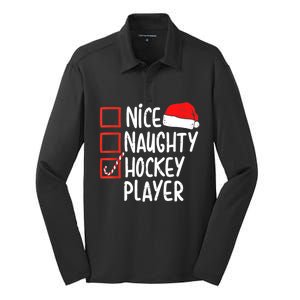 Nice Naughty Hockey Player Christmas Funny Xmas Santa Hat Gift Silk Touch Performance Long Sleeve Polo