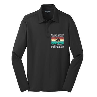 Never Stand Between A Girl And Her Rottweiler Silk Touch Performance Long Sleeve Polo