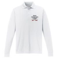 Never Stand Between A Woman And Her Diet Co Ke Performance Long Sleeve Polo