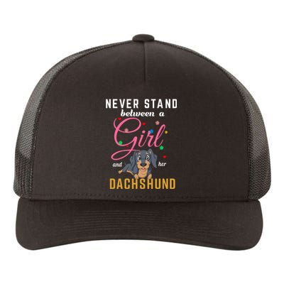 Never Stand Between A Girl And Her Dachshund Yupoong Adult 5-Panel Trucker Hat