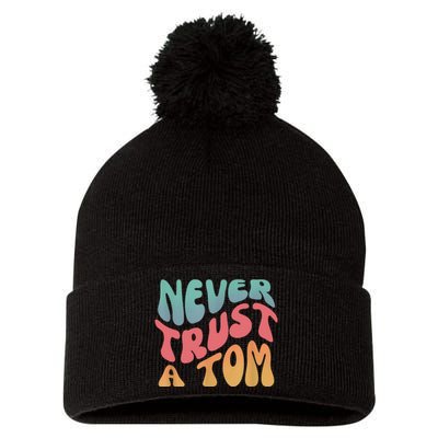 Never Trust A Tom Team Ariana Pom Pom 12in Knit Beanie