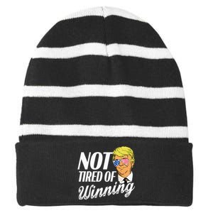 Not Tired Of Winning Trump 45 47 America 2024 Striped Beanie with Solid Band