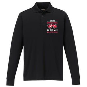 Never Underestimate An Old Who Loves Skiing Gift Performance Long Sleeve Polo