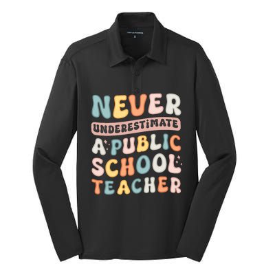 Never Underestimate A Public School Teacher Silk Touch Performance Long Sleeve Polo