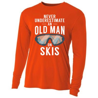 Never Underestimate An Old On Skis Winter Sport Skier Gift Cooling Performance Long Sleeve Crew