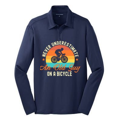 Never Underestimate An Old Guy On A Bicycle Cycling Silk Touch Performance Long Sleeve Polo