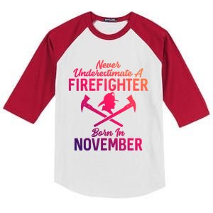 Never Underestimate A Firefighter Born In November Funny Bir Funny Gift Kids Colorblock Raglan Jersey