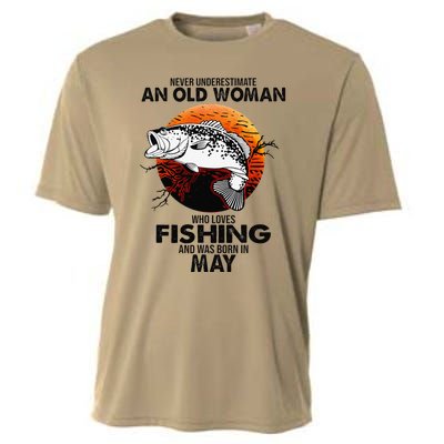 Never Underestimate Old Woman Loves Fishing Born In May Cooling Performance Crew T-Shirt