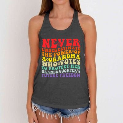 Never Underestimate The Power Of A Grandma Who Votes Groovy Women's Knotted Racerback Tank