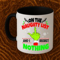 On The Naughty List And I Regret Nothing Middle Finger Funny Christmas Mug